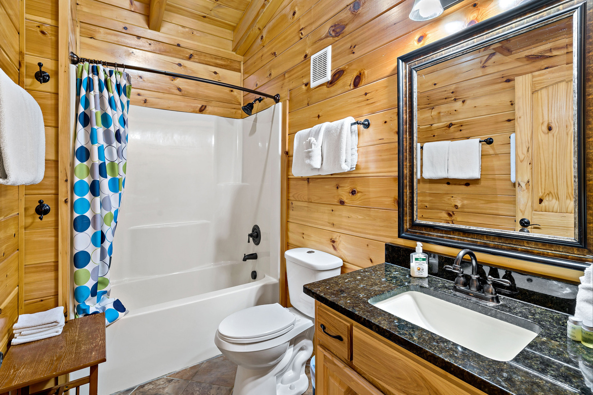 Full bathroom with shower and tub combo