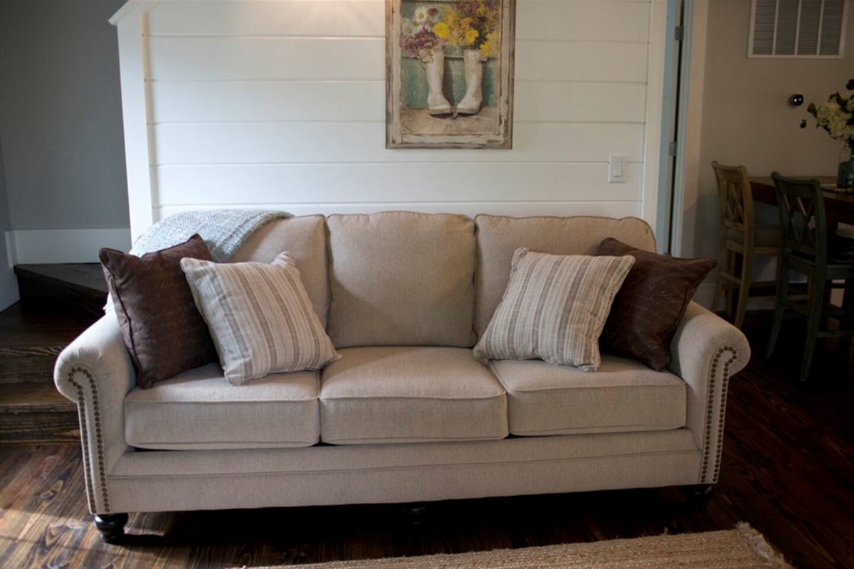 Sleeper sofa in downstairs of Storybrook Cottage rental in Arkansas