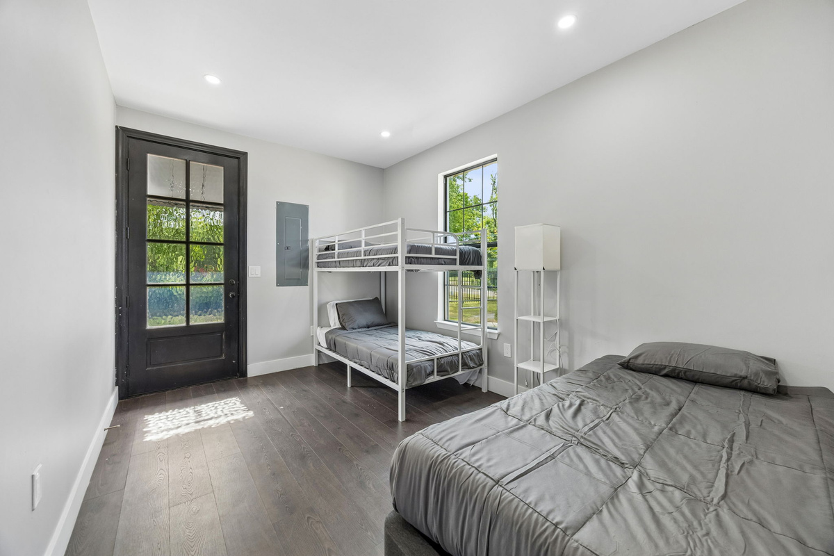 A versatile family-friendly room with bunk beds and an additional twin bed, perfect for kids and extra guests.