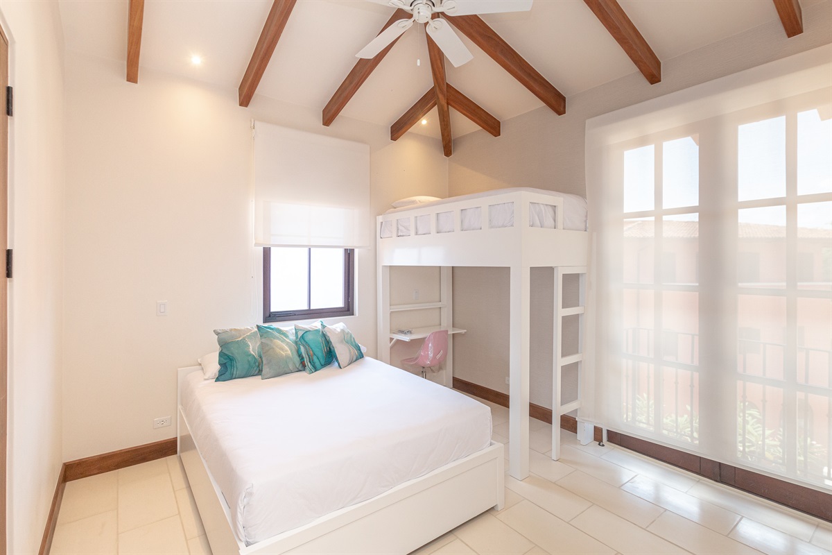 Right wing secondary bedroom with queen bed and twin bunk with on suite bathroom.
