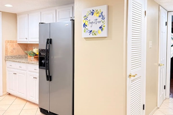 Spacious stainless steel refrigerator offers plenty of storage — perfect for longer stays, grocery runs, or group meals.