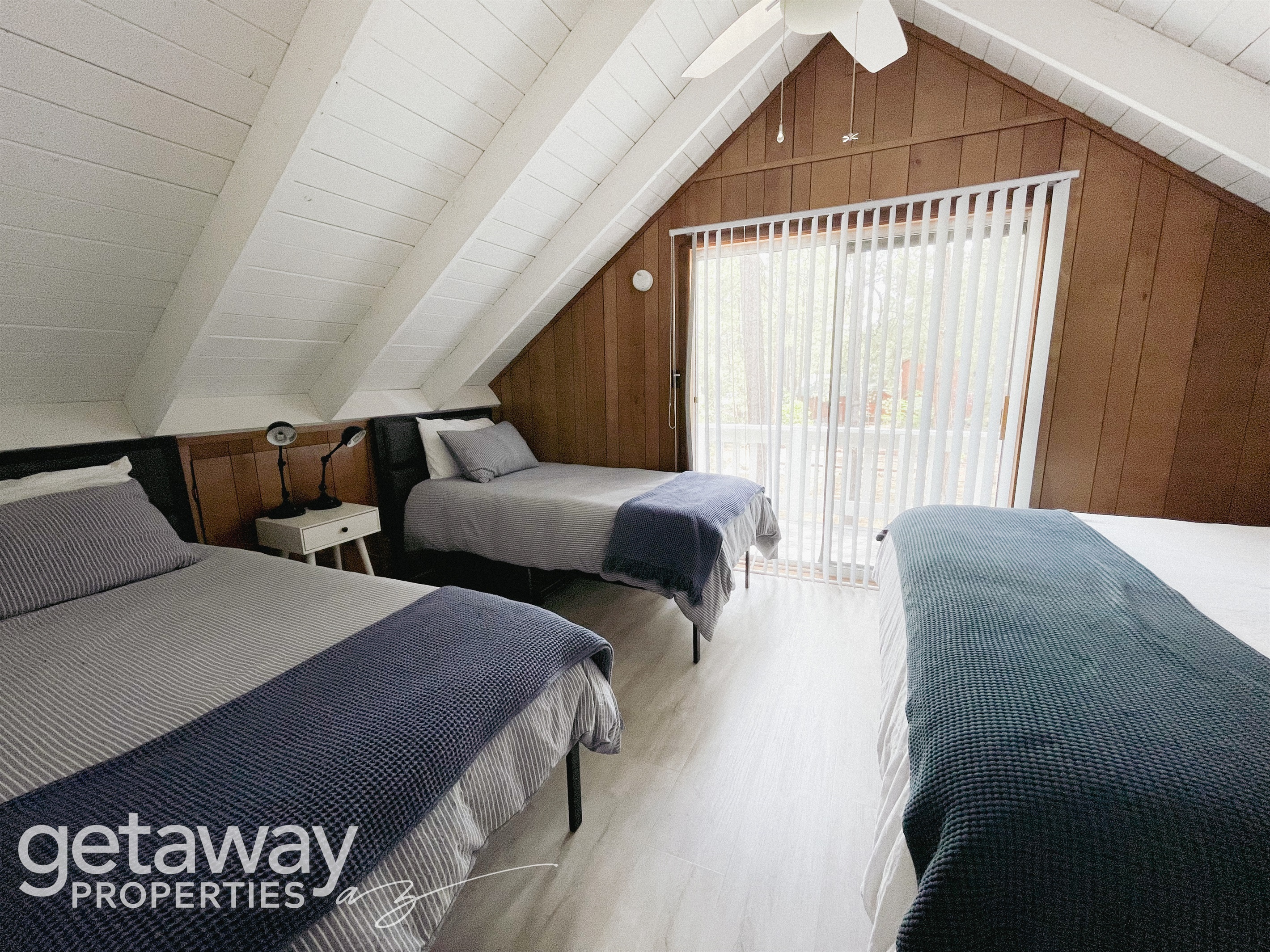 Main-floor bedroom with fresh linens and easy bathroom access.