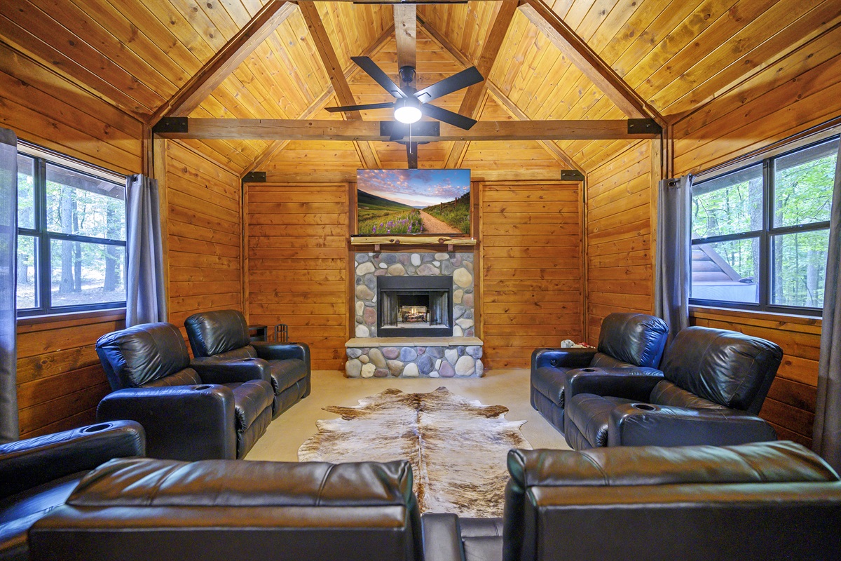 The media room is the best place at the cabin to catch the game. 7 electric recliners.