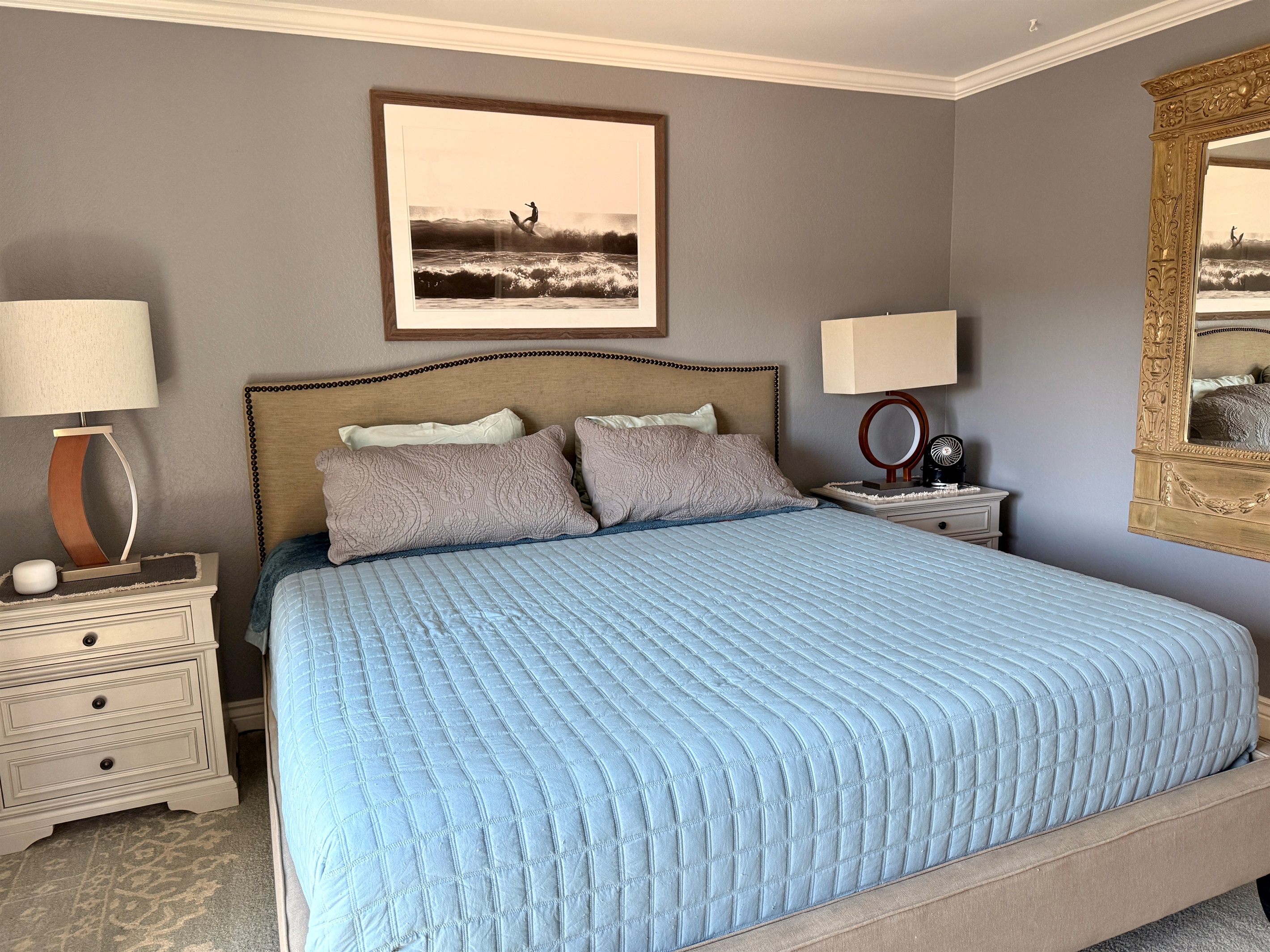 Primary bedroom with king sized bed and attached balcony with a sitting area perfect for a morning coffee with a view.