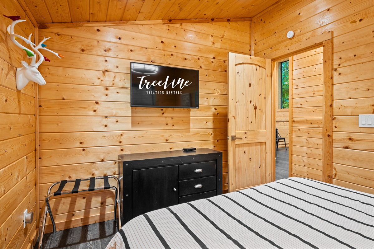 This view of the queen bedroom offers a comfortable and relaxing setup, with just the right amount of space to unwind.
Another bedroom provides a simple yet cozy retreat, making it easy to settle in and feel at home.