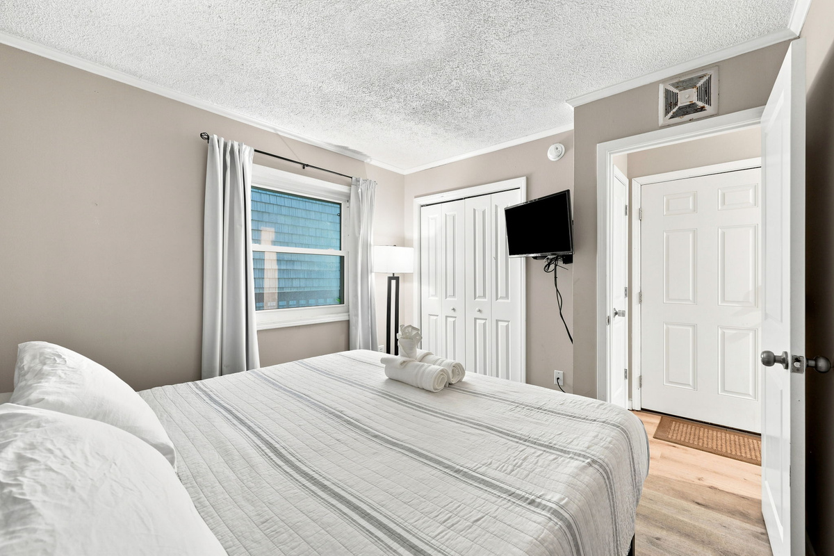 Enjoy a relaxing retreat with a comfortable sleeping area, closet storage, and a convenient layout for guests