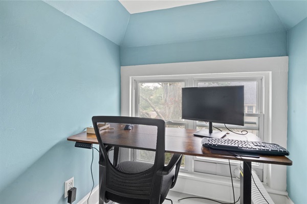 Upstairs Loft Desk where we provide a monitor and keyboard for you to use if you would like. The desk is a sit/stand desk.