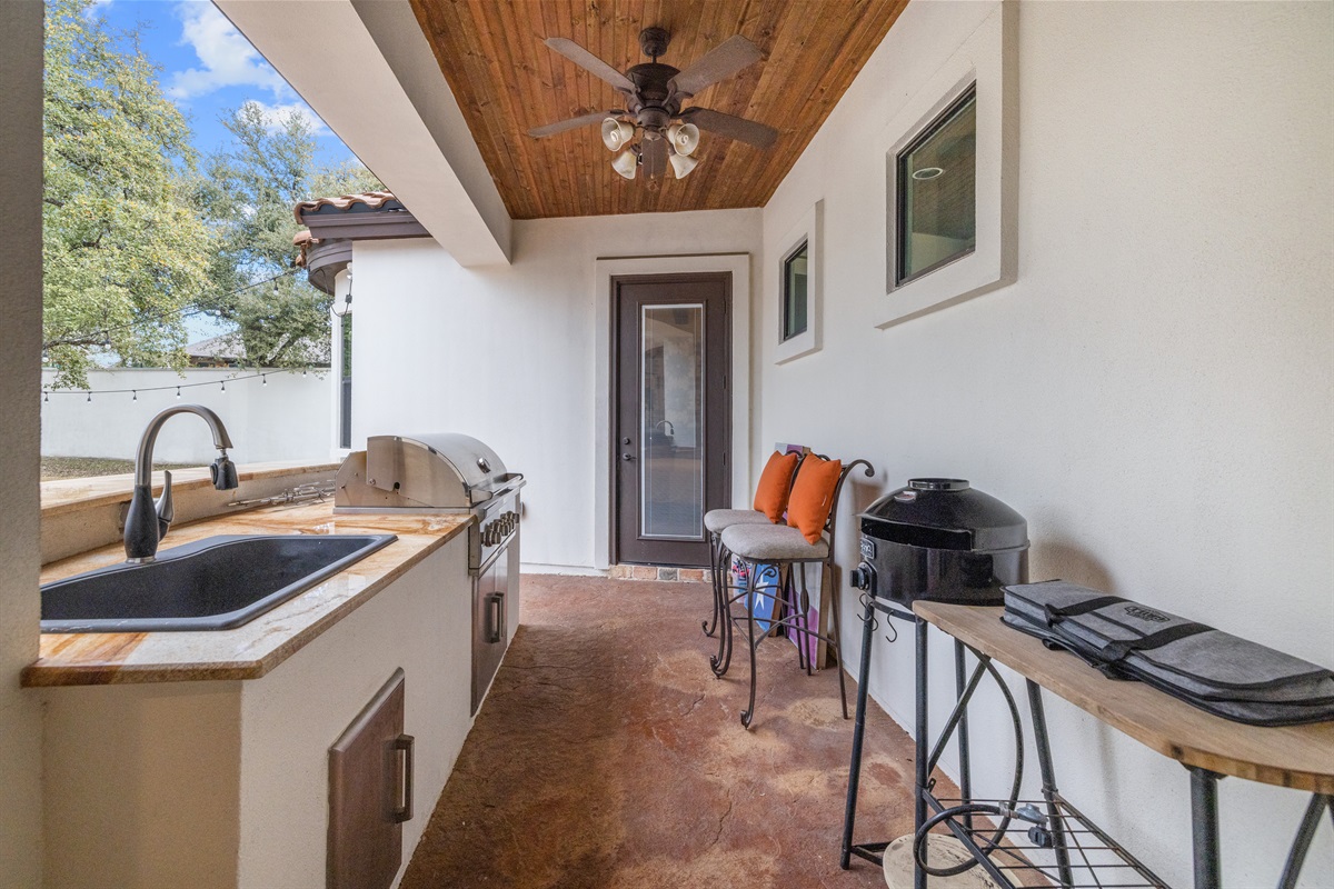 "Fire up the flavor in this stunning outdoor kitchen! 🔥🍔 Featuring a brand-new Coyote grill, sink, and plenty of prep space, this is the perfect spot for backyard barbecues and al fresco din