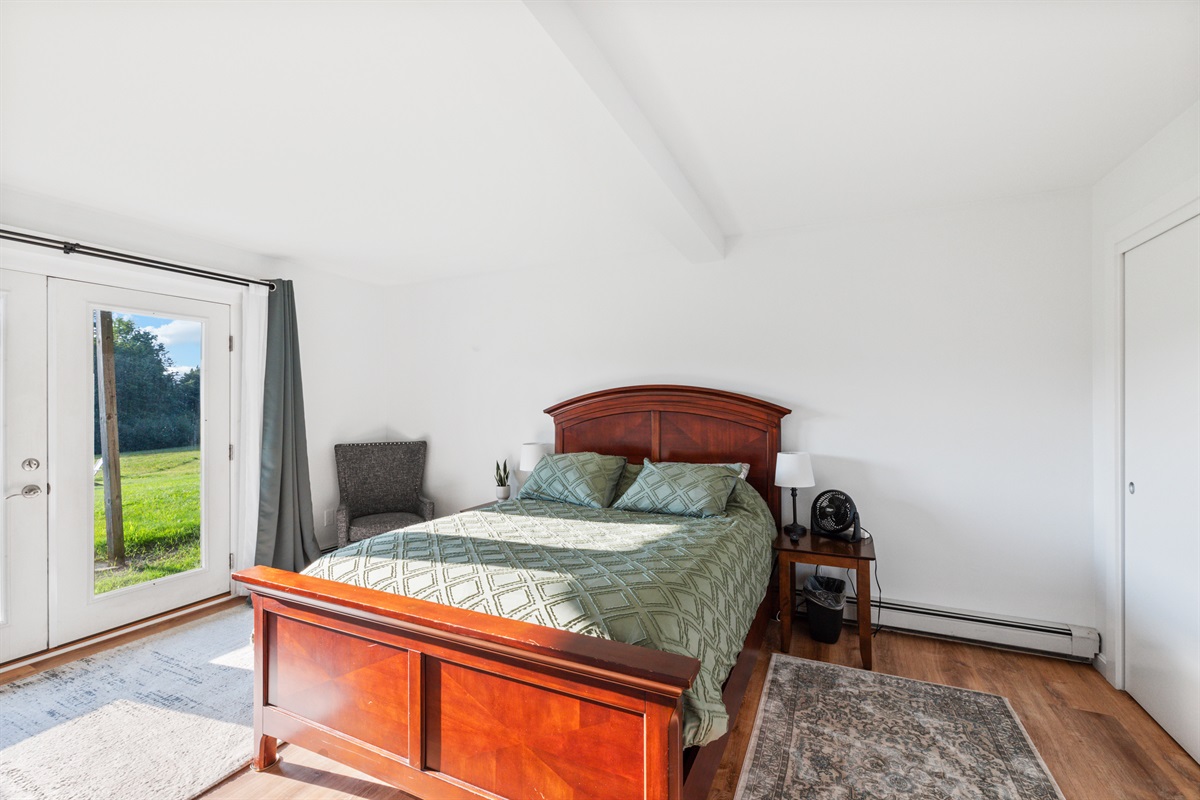 Downstairs Bedroom with queen bed and 55" Smart TV