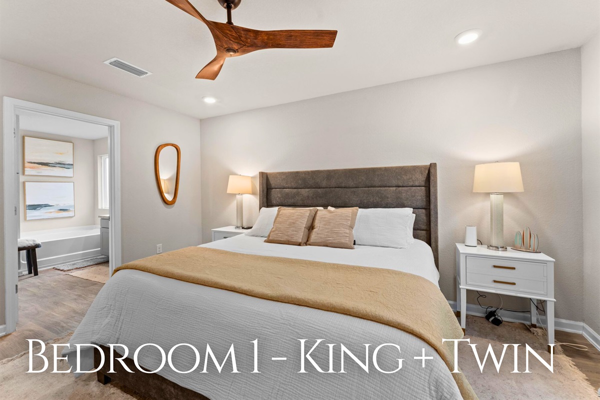 The primary bedroom features a king bed along with an extra twin, offering flexible sleeping options for families or groups.