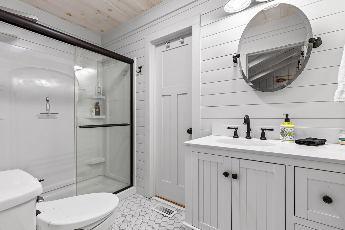 The updated bathroom is bright, clean, and stocked with essentials for your stay.