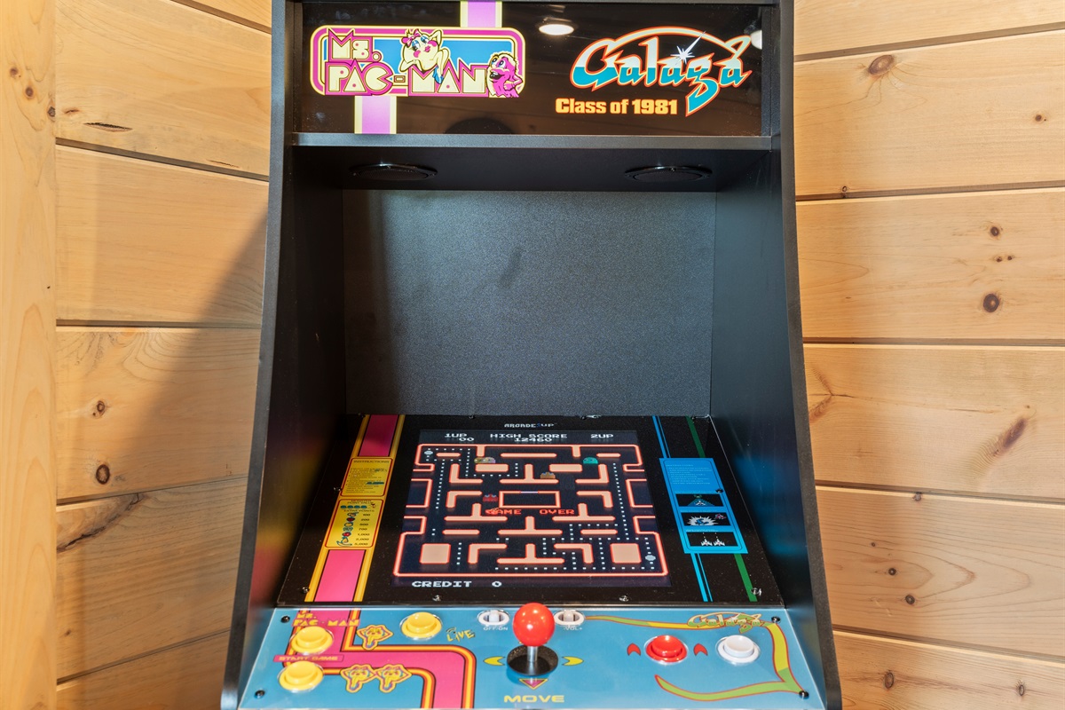 Level up your stay with a dose of nostalgia! Featuring a classic Ms. Pac-Man arcade game, 65" smart TV, this cozy game room is the perfect hangout for guests of all ages.