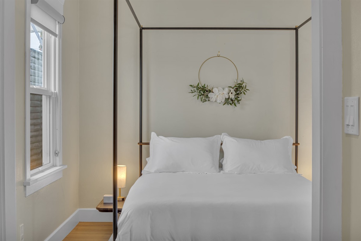 Cozy up in our dreamy canopy bed with luxe linens and soft lighting. The perfect retreat after a day exploring San Diego.