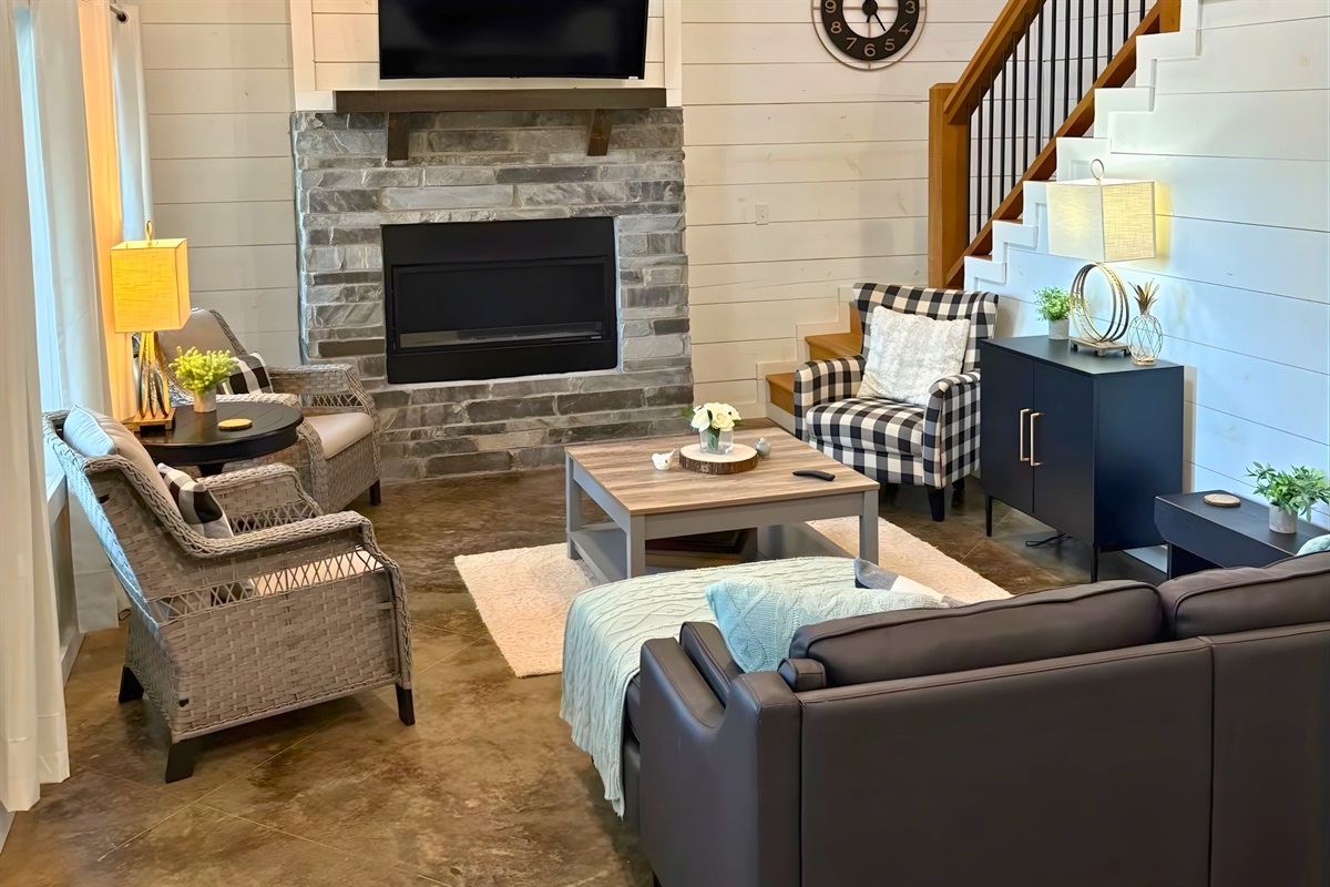 Lounge, laugh, relax. Our living room is made for easy days and cozy nights.