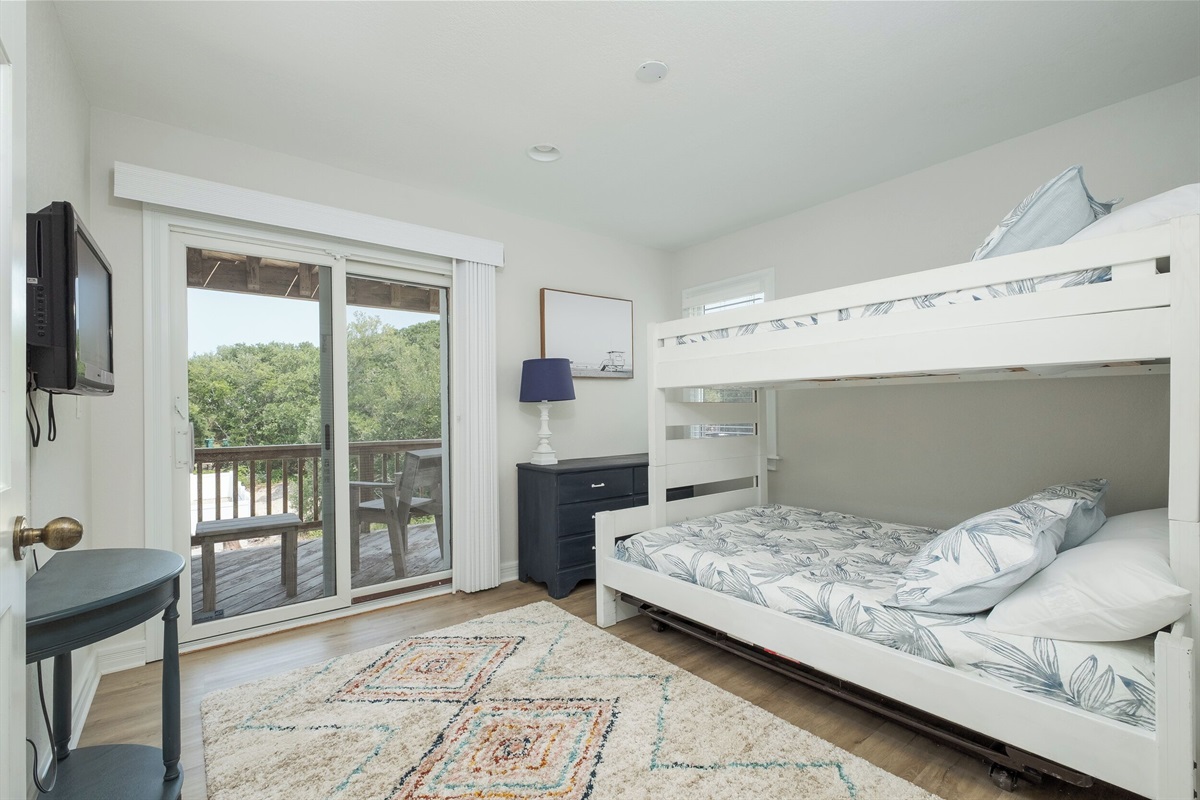 2nd fl bunk room! Twin over Full bed for a comfy rest & Deck Access!