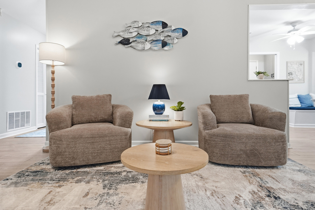 Two cozy lounge chairs provide a comfortable spot for conversation or morning coffee.