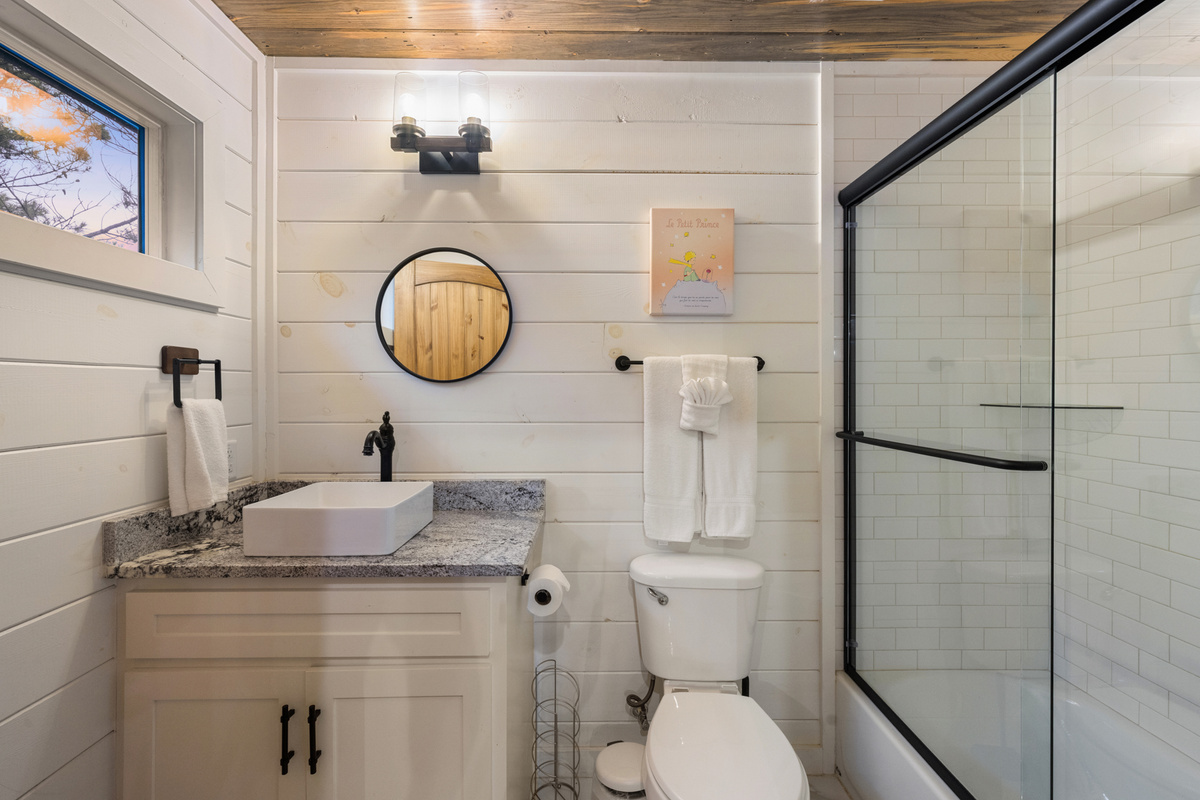Bunk room bathroom convenience that keeps the fun upstairs easy and stress free. 
Bright, modern, and just steps from the bunk loft so everyone can rinse off and recharge between adventures.