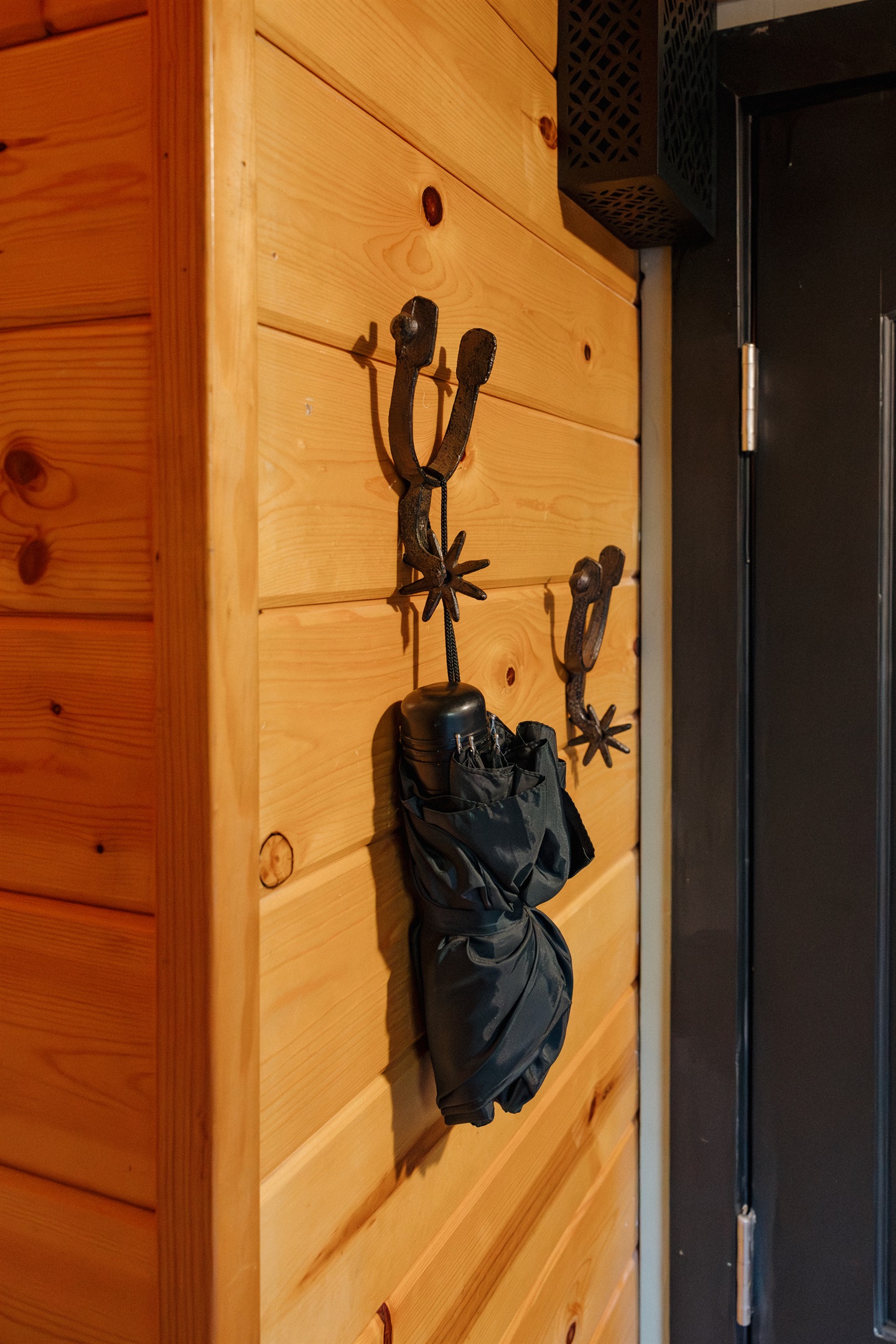 Authentic western details like horseshoe hooks add character at Poppywood Pines. This gothic western Show Low A-frame features thoughtful design touches throughout, creating a unique White Mountains vacation rental experience near hiking, fishing, and skii