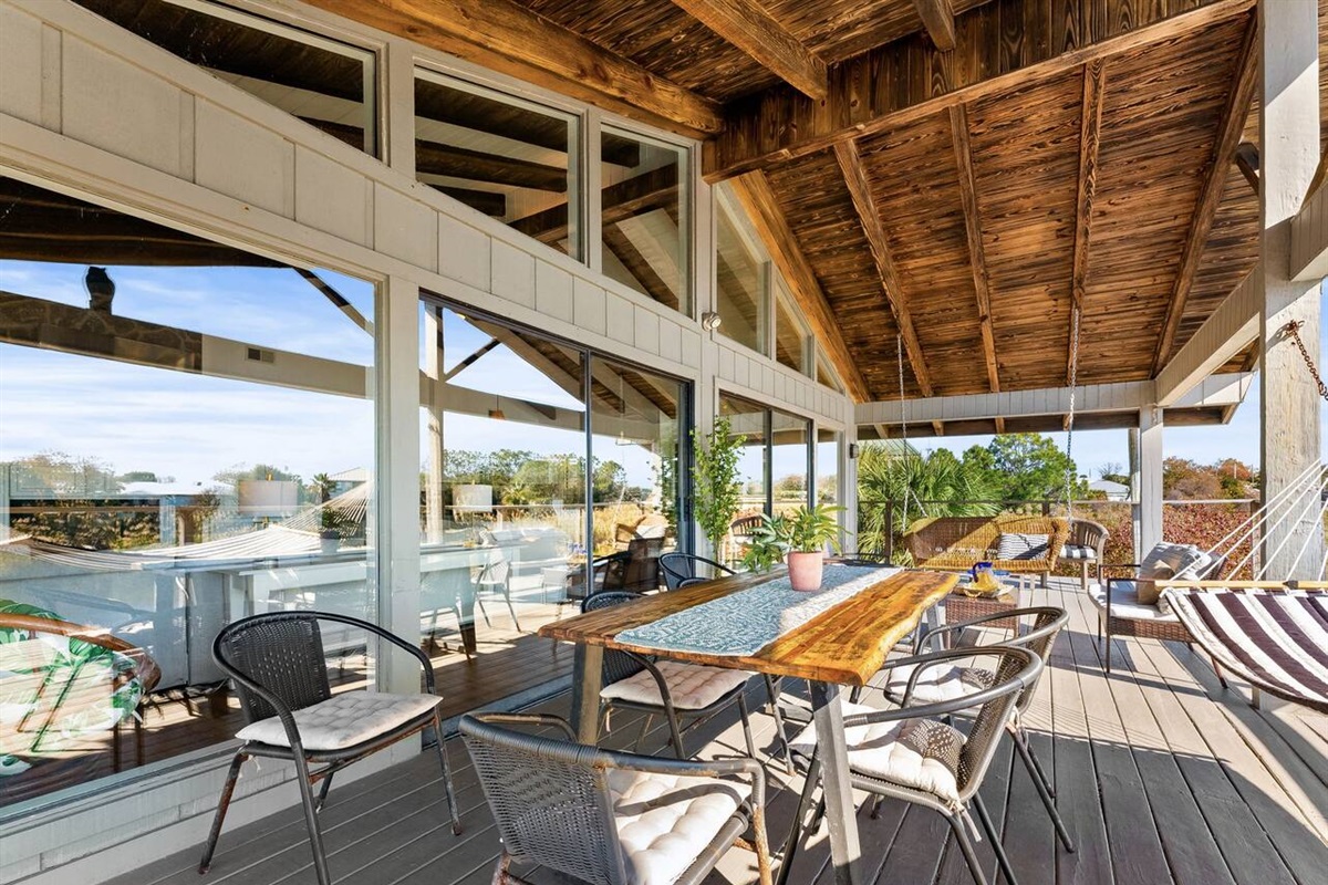 Dine al fresco on the private balcony overlooking the water.