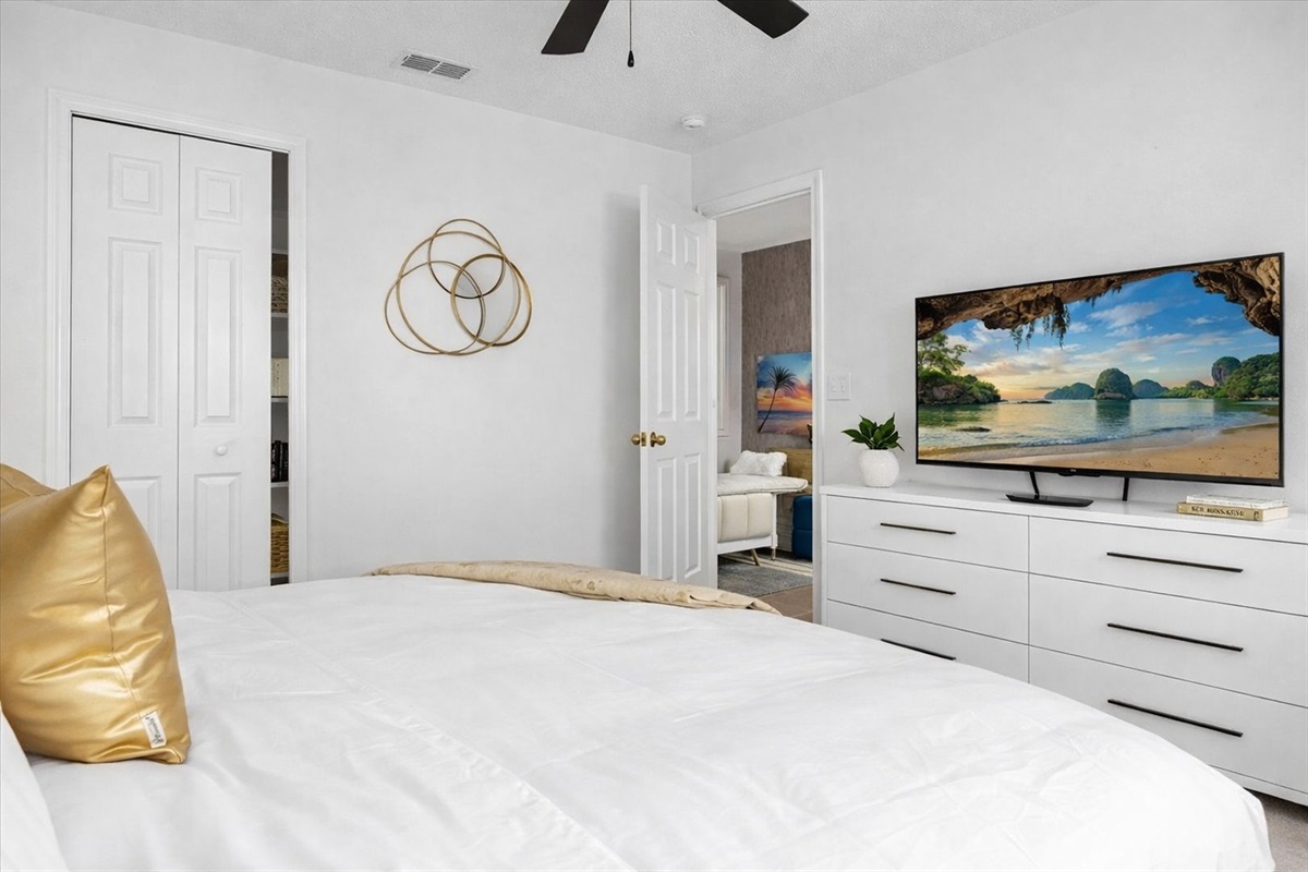 KING bedroom featuring a 50" Roku tv and dresser