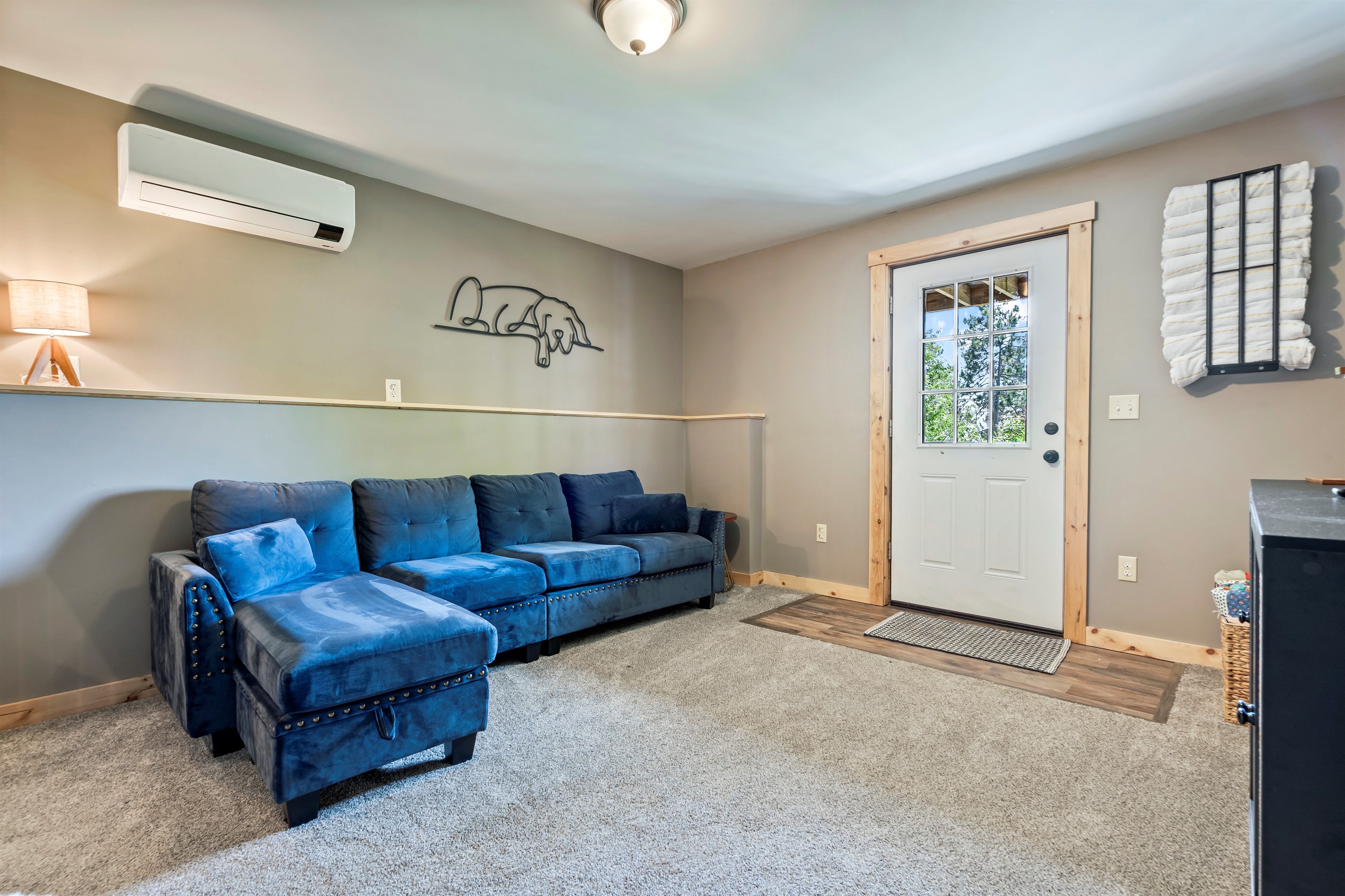 Enjoy an additional lounge area downstairs, complete with a cozy setup for movie nights.