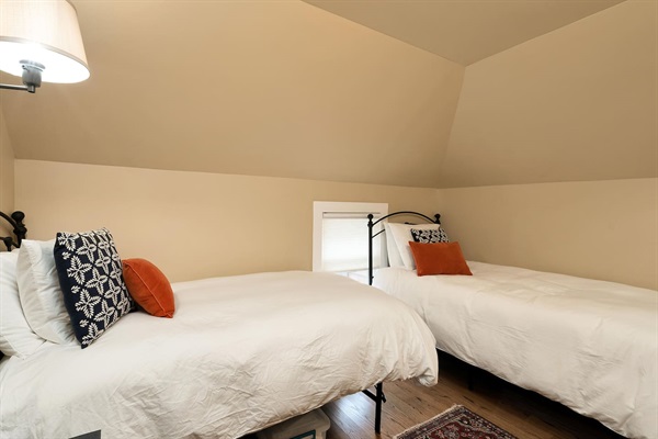 2nd Level Guest Room: Features two comfortable twin beds and ample space, providing a cozy and private retreat for extra guests or family members.