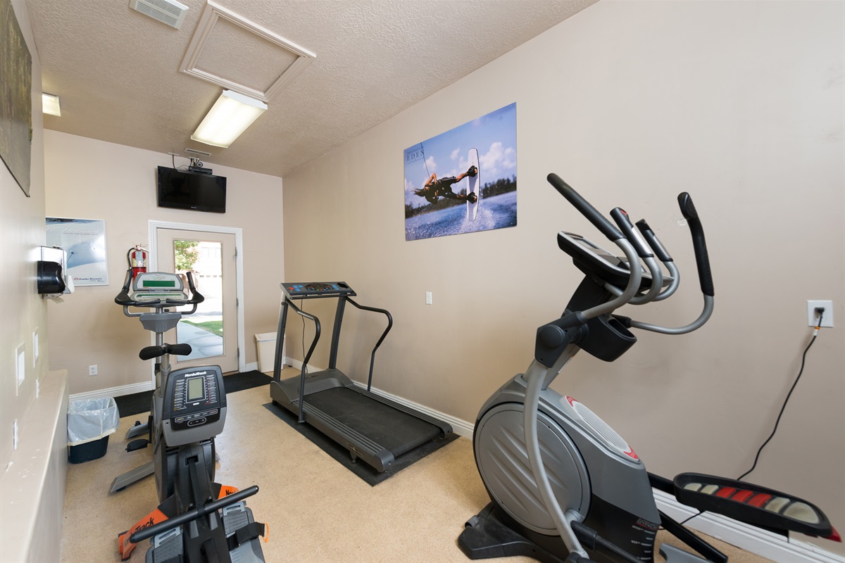 Another view of the fitness facility highlights well-maintained equipment and a clean, accessible space for your routine.