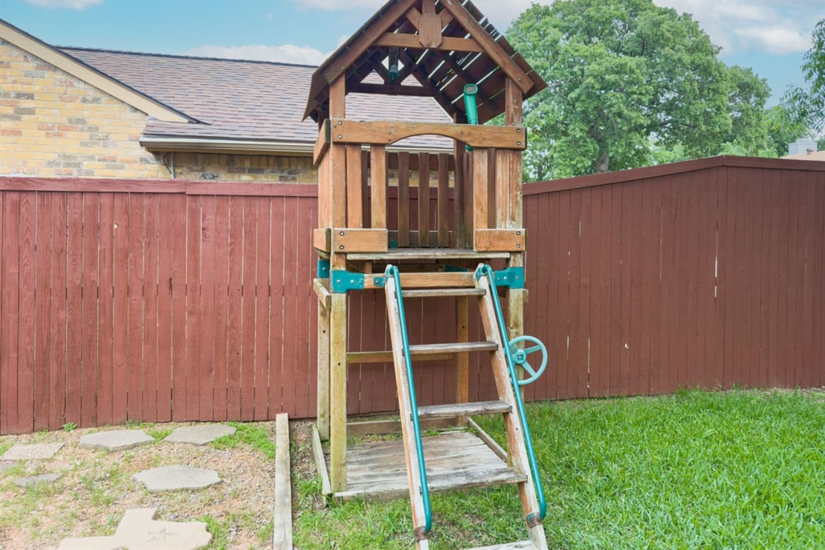 Backyard playset for kids to enjoy outdoor fun.