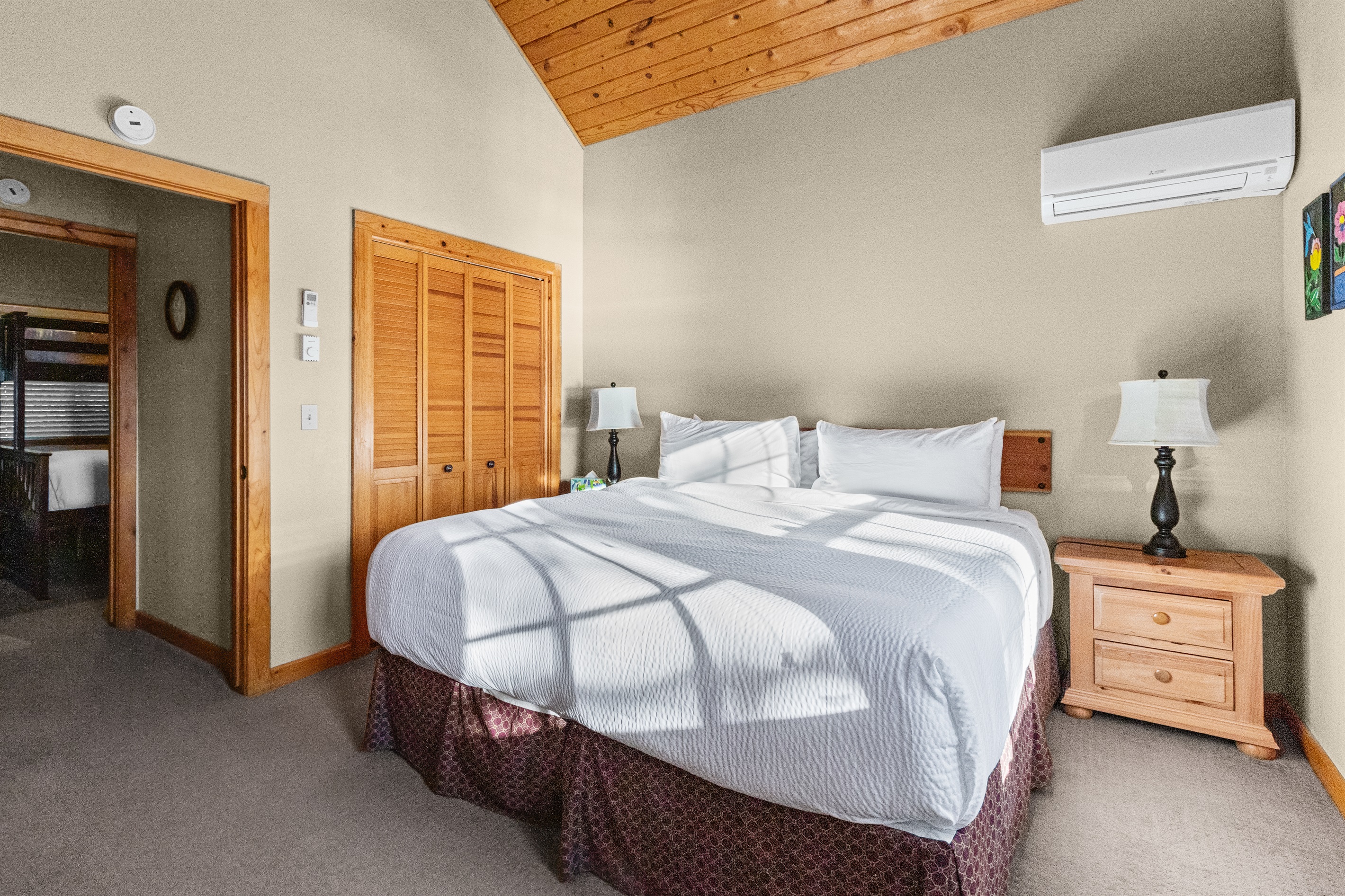 Bedroom 2 — king with lake-view balcony