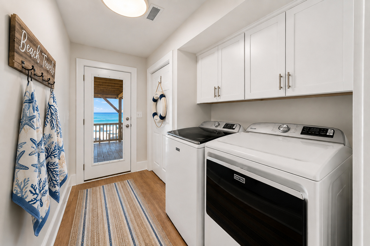 Keep sandy beach towels and vacation essentials fresh with the home's full-size laundry setup.