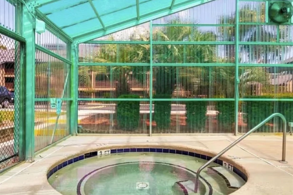 Jacuzzi in indoor pool area. 