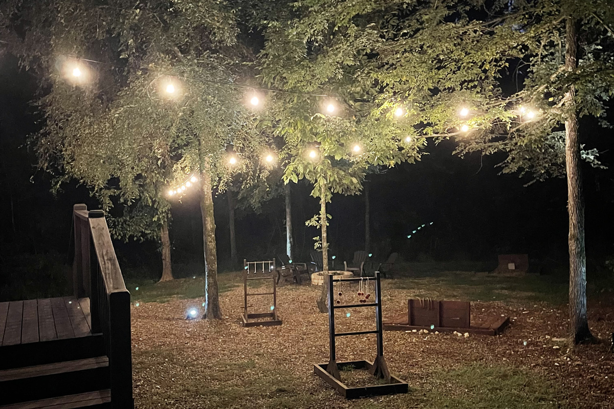 Party lights light up the backyard play space.