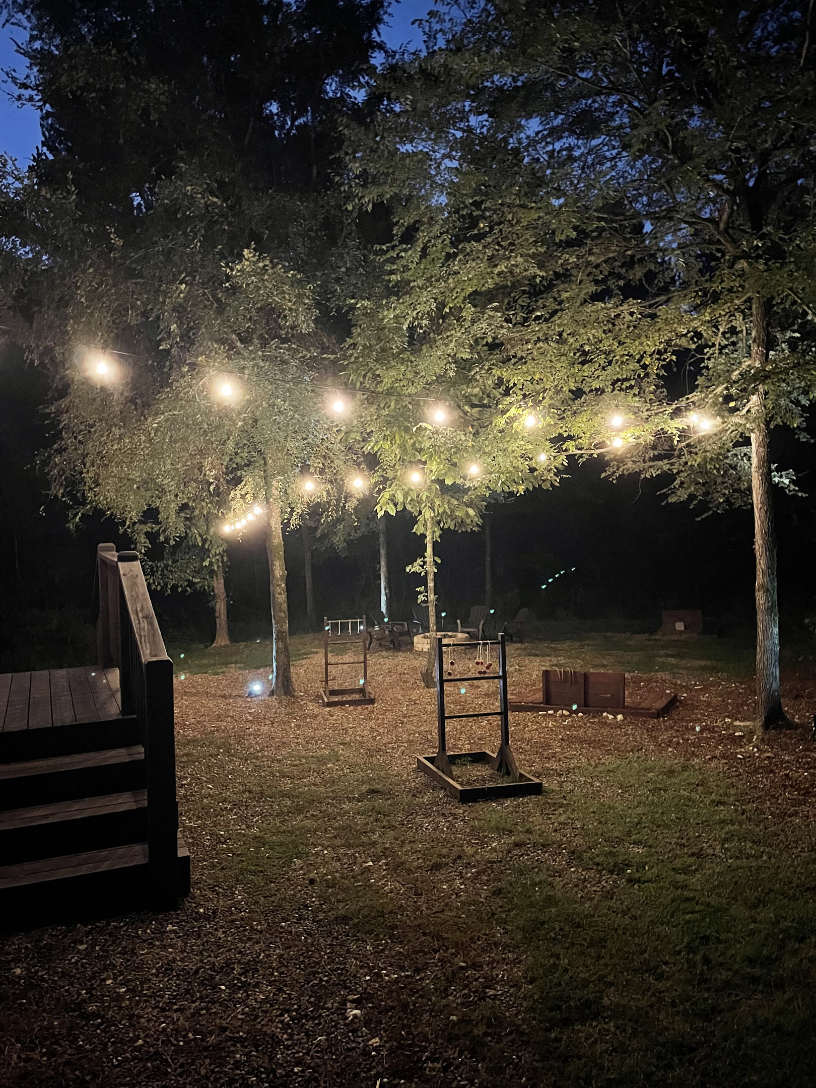 Party lights light up the backyard play space.
