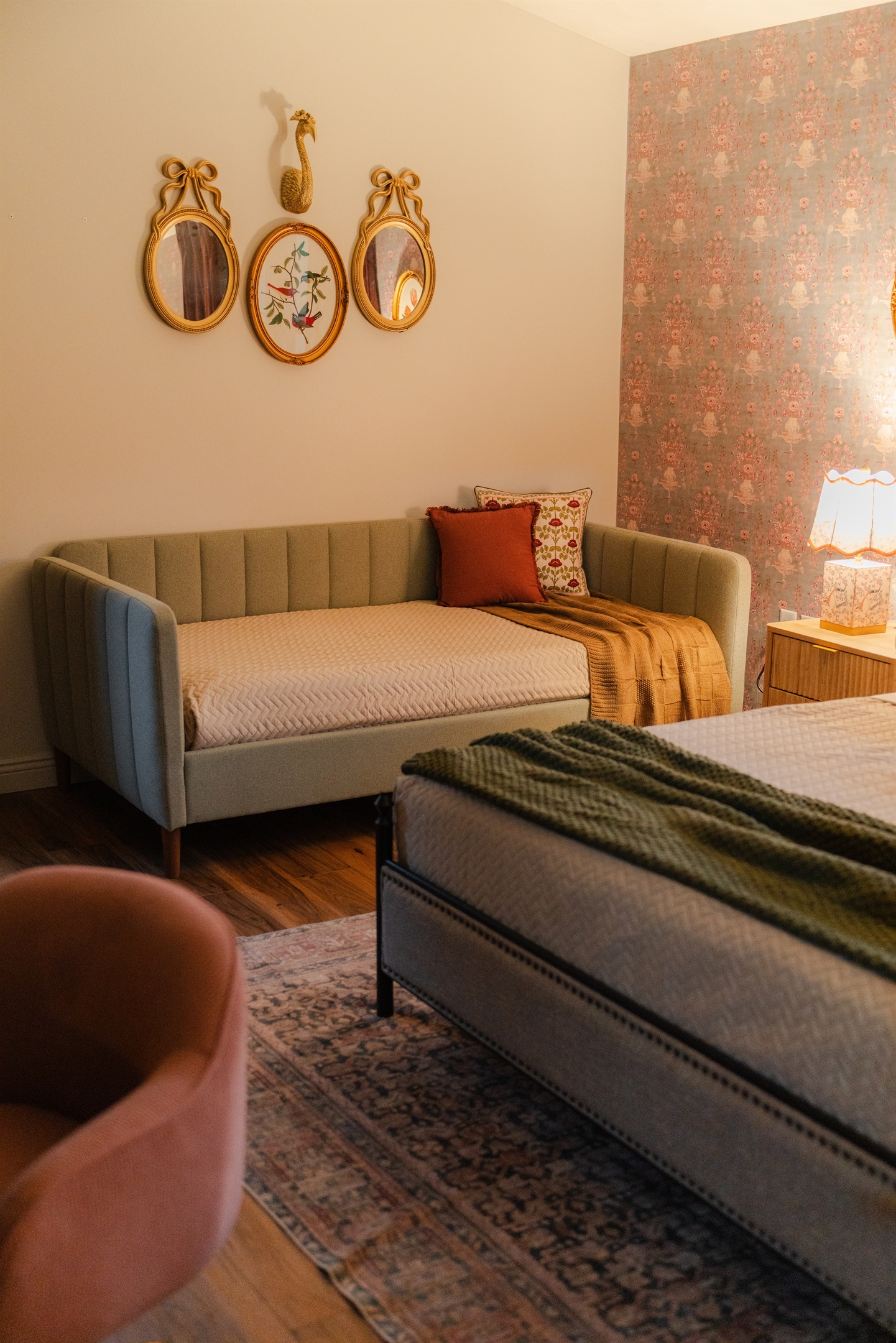 Enjoy a comfortable bedroom setup with added sleeping space from the daybed.