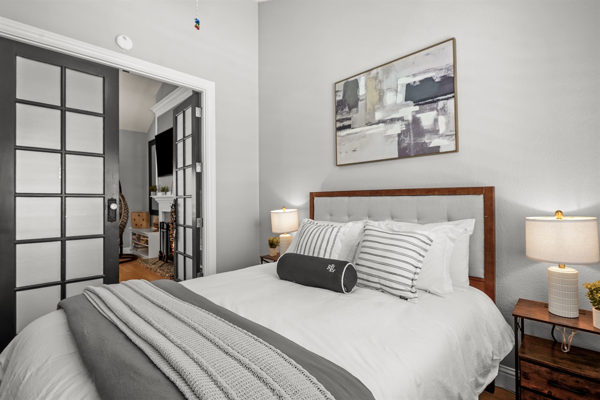 Bedroom 5 is conveniently located downstairs and features a comfortable queen bed, making it an ideal option for guests who prefer to avoid stairs or want additional privacy away from the upstairs bedrooms. With a cozy and relaxing atmosphere, this room pr