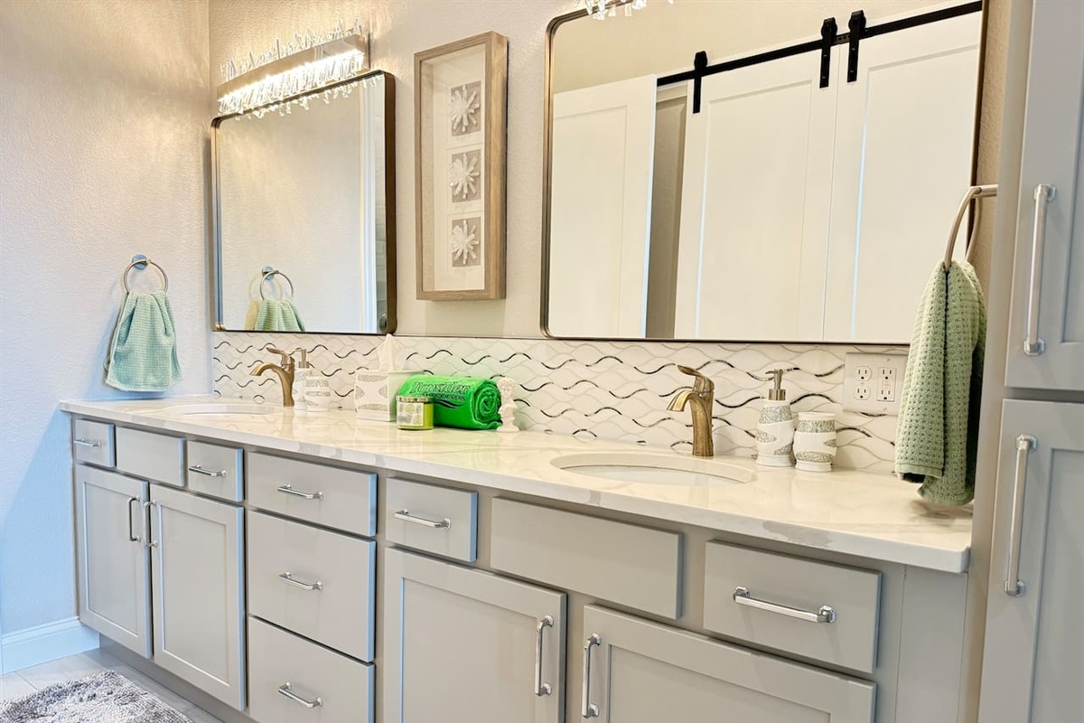 Large mirror reflect lots of light in this spacious master bathroom 