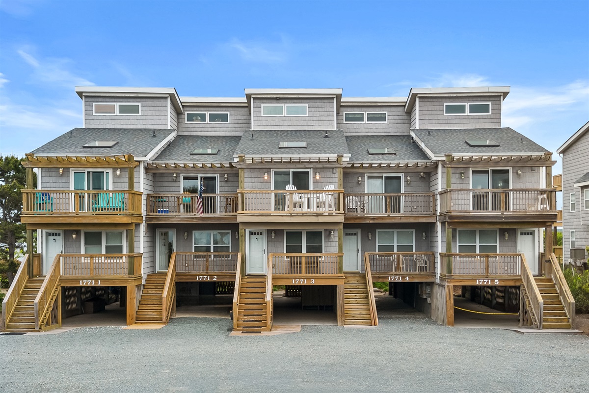 Charming coastal-style building with private entrances and covered parking