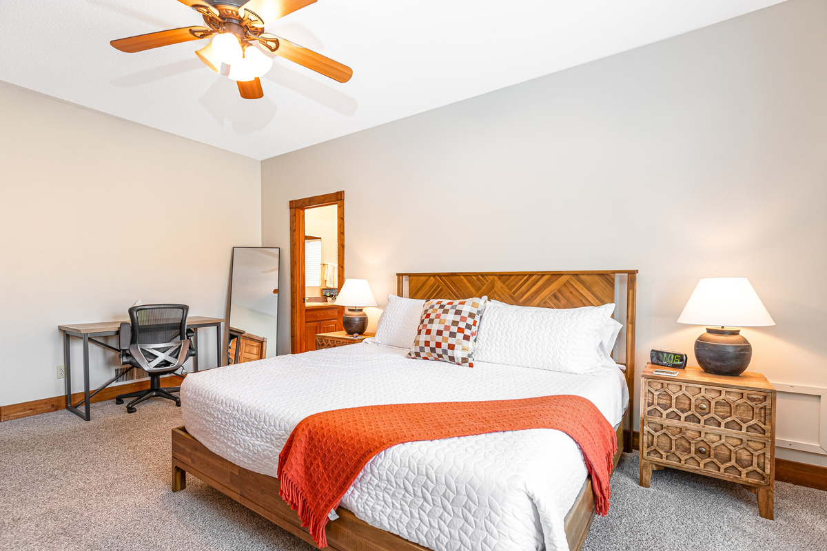 The Primary Bedroom has a king bed with full ensuite bathroom, one of two bedrooms located on the main floor.