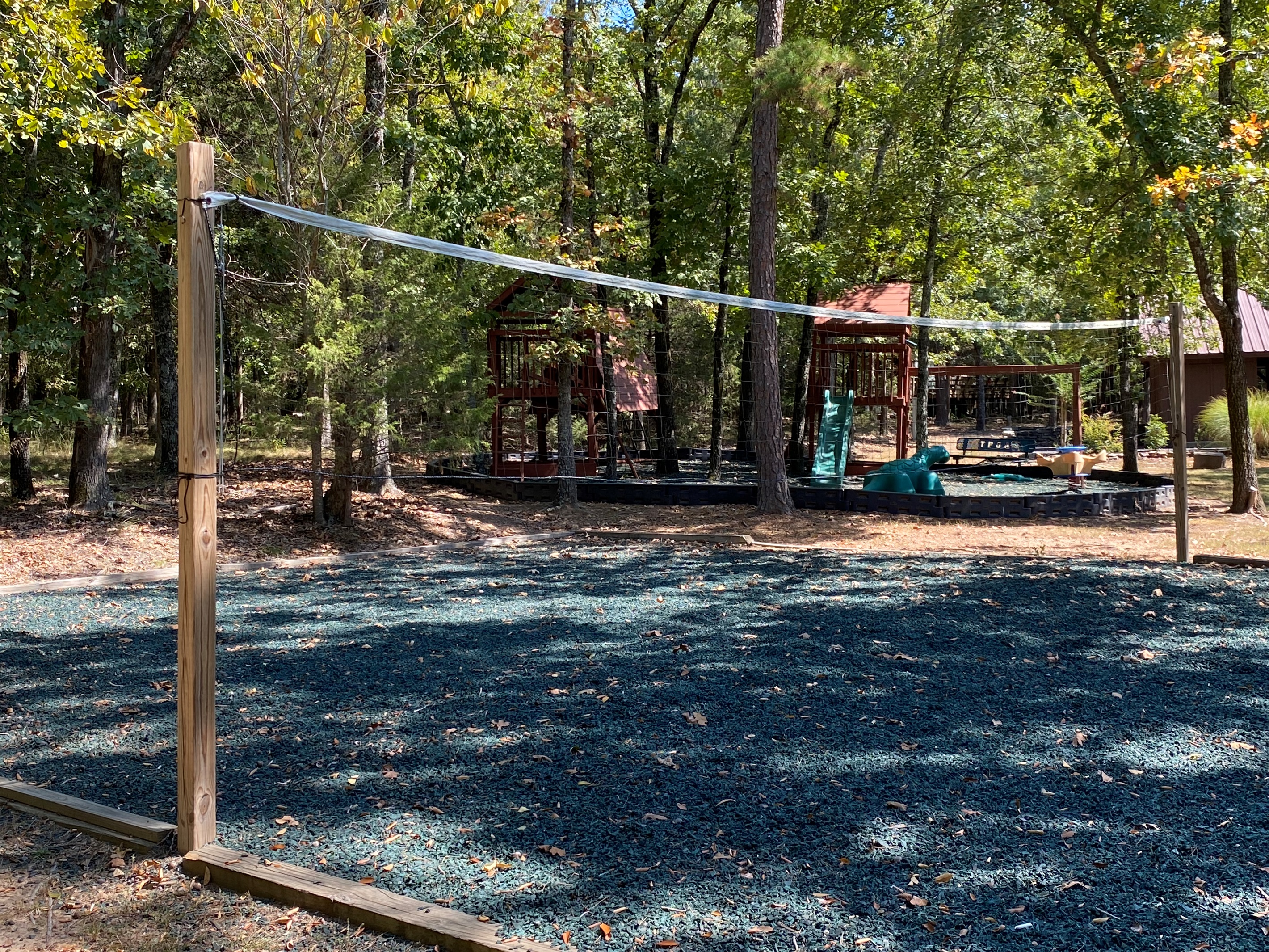 Just a short drive away, the community playground and volleyball court offer fun for all ages beneath a shady canopy of trees.