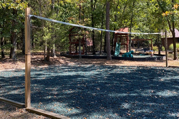 Just a short drive away, the community playground and volleyball court offer fun for all ages beneath a shady canopy of trees.