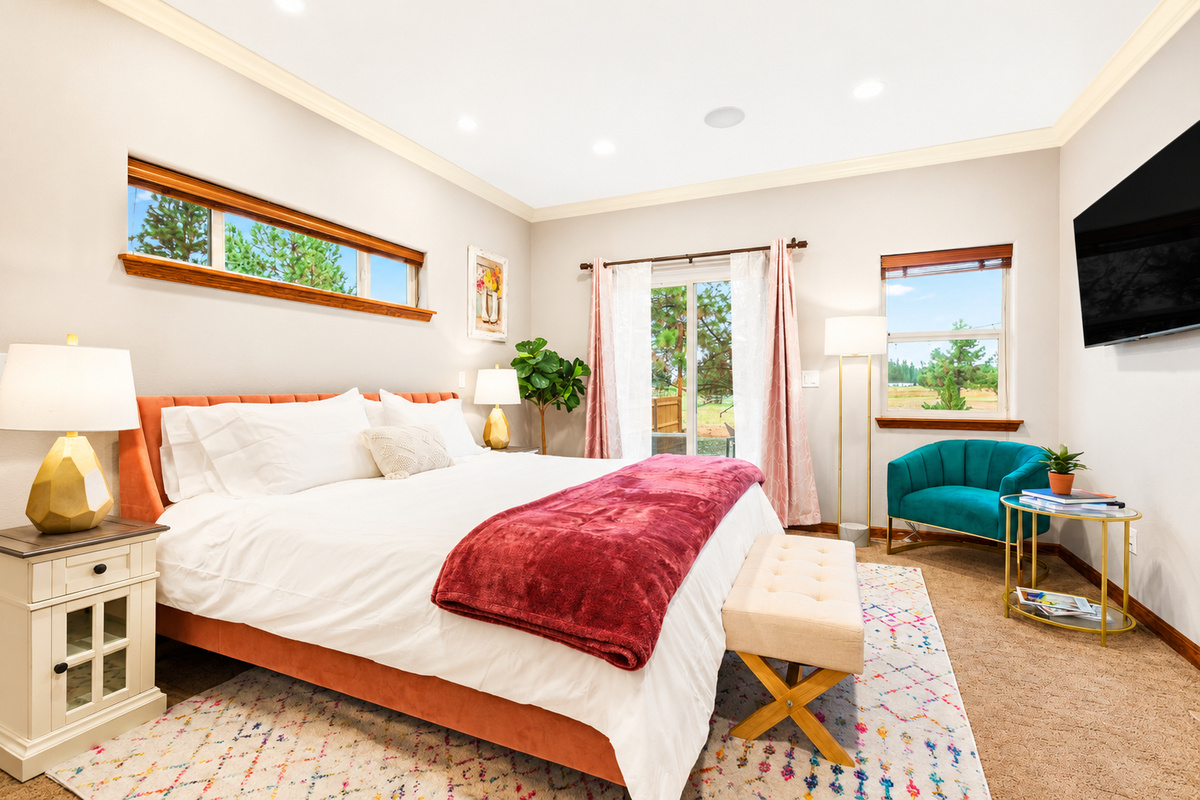 Escape to pure comfort in our mainfloor master bedroom. Sink into the embrace of premium linens atop a king bed, where tranquility meets luxury. With modern amenities and serene views from the patio, your stay promises relaxation and indulgence.