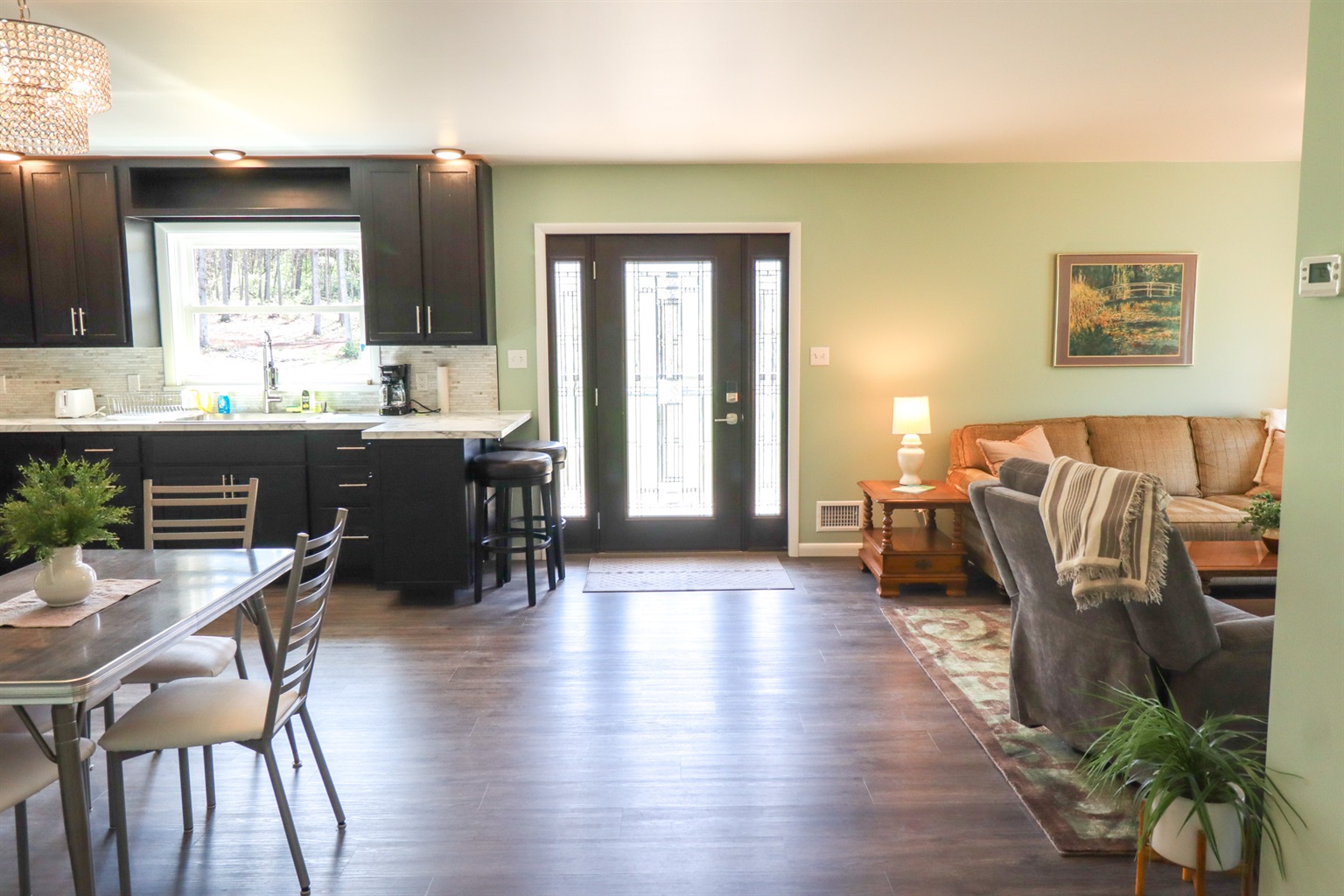 View of entry, dining, and living area. 