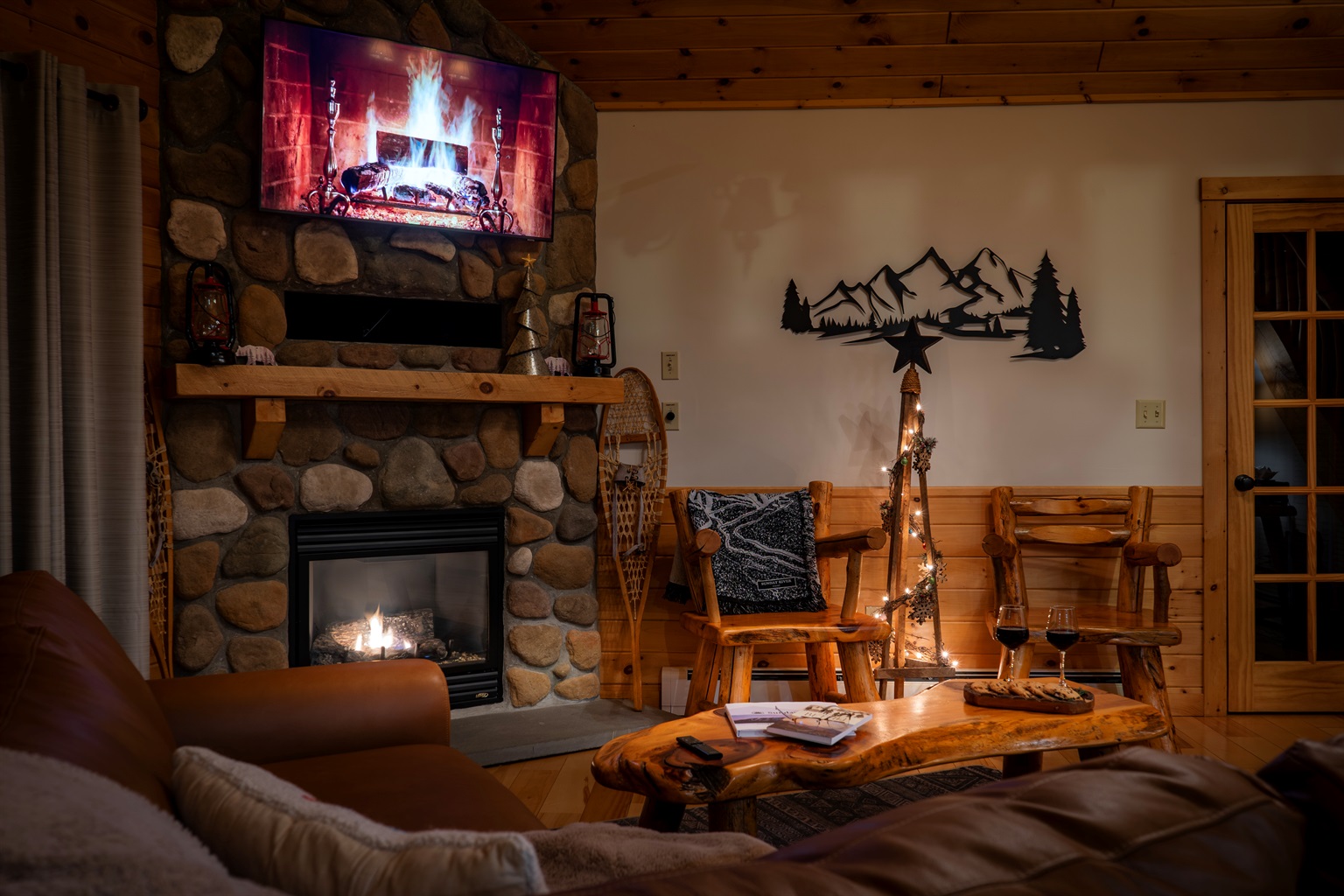 The living room offers comfort and warmth with a beautifully designed fireplace.