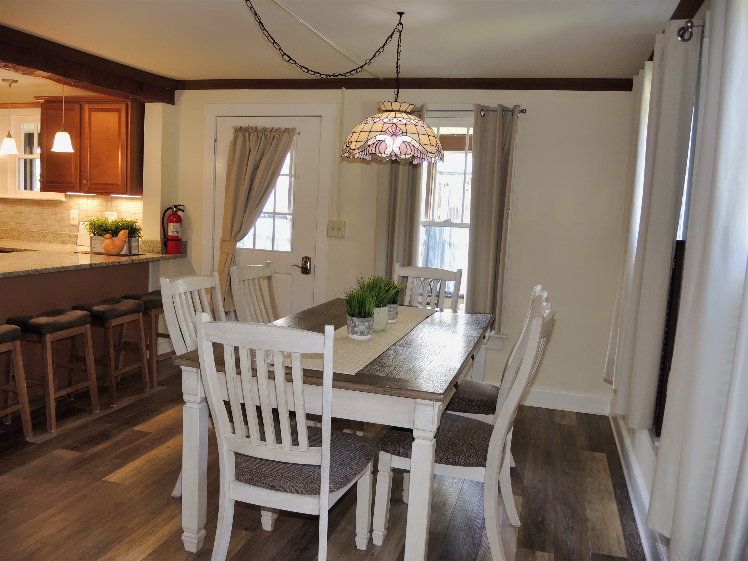 Large dining table with seating for up to 6 people.