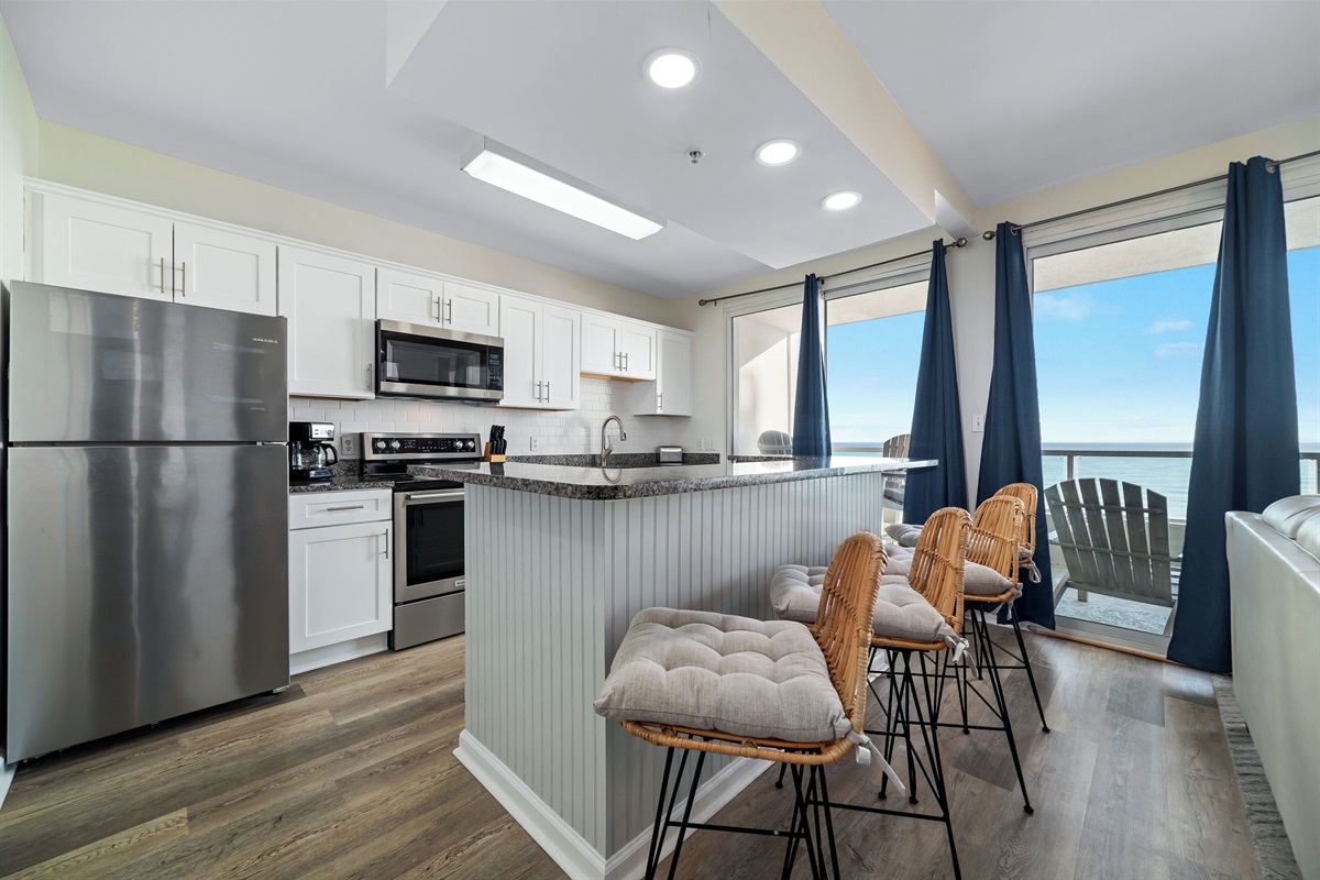 Beautiful stocked kitchen with Stainless appliances, granite tops and tiled backsplash! 