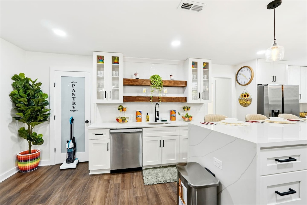 Beautiful white kitchen fully equipped with all the appliances and essentials of a home away from home.