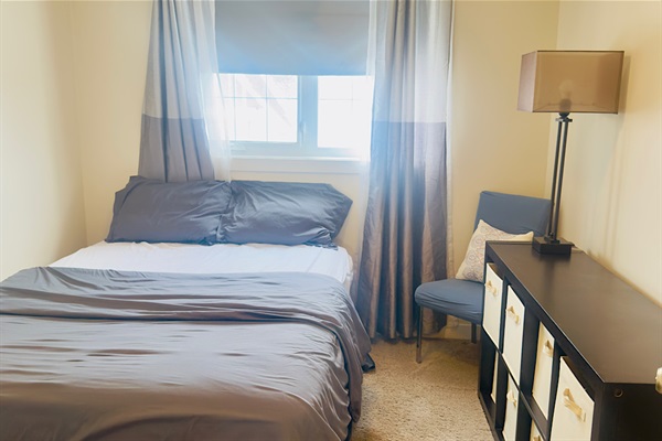 Queen sized bed, full closet and black out curtains.