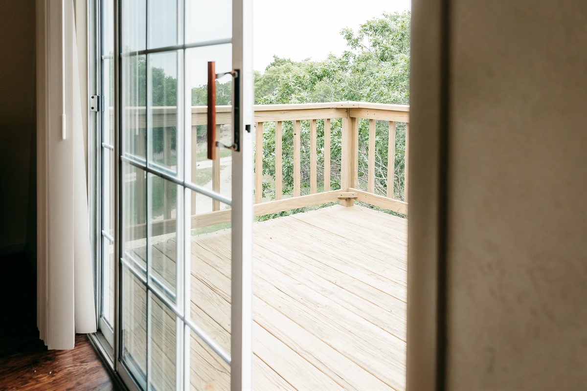 sliding doors to deck to enjoy the view of the hill country