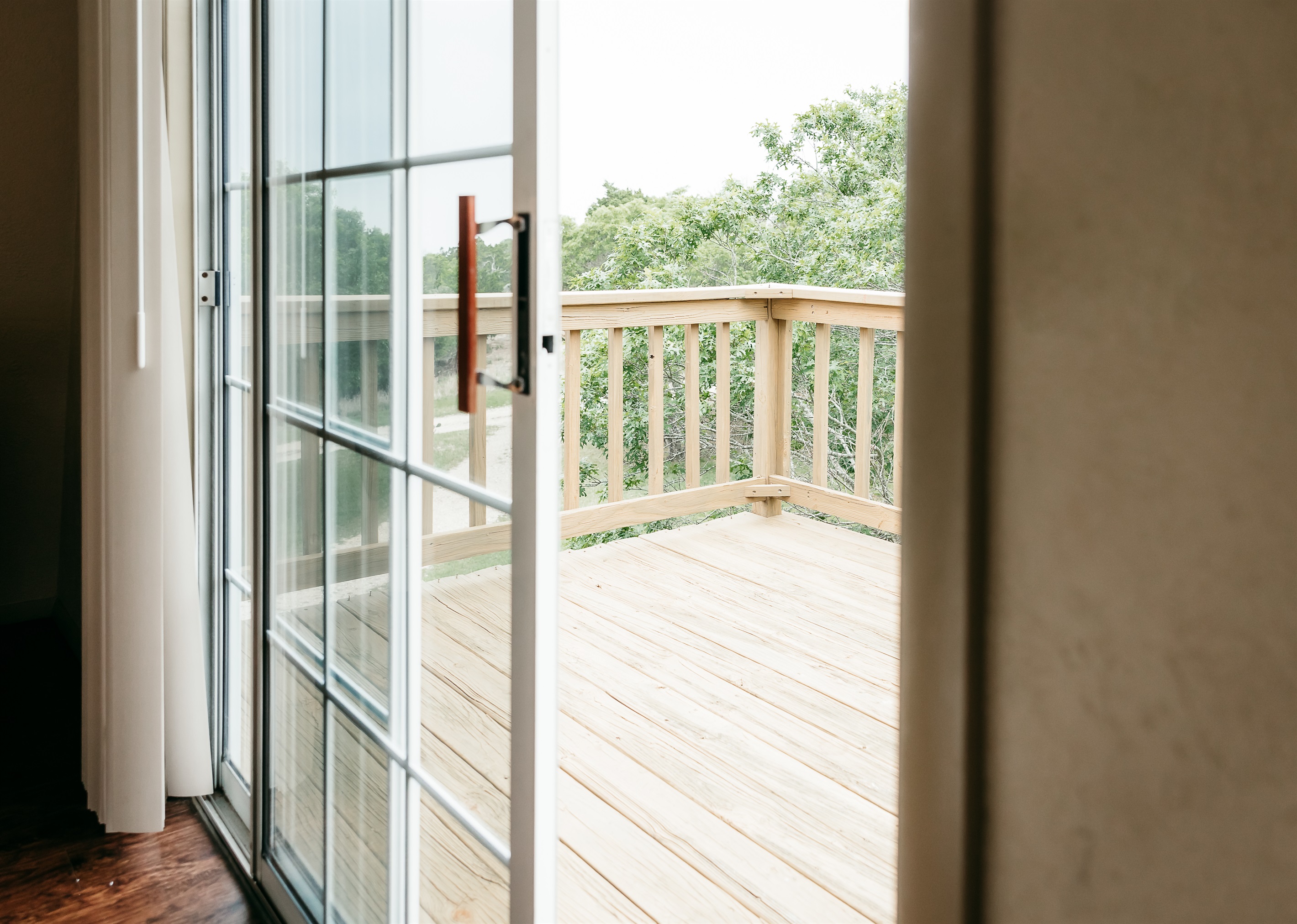 sliding doors to deck to enjoy the view of the hill country