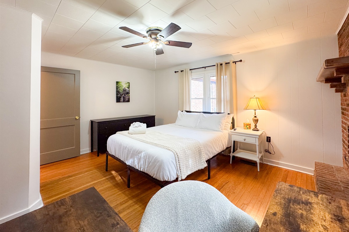 Our second guest bedroom features a queen size bed with comfy, high thread count linens and shredded bamboo pillows! The beds are cooling memory foam with a medium firm feel. Please note the fireplace is not a functional fireplace. 